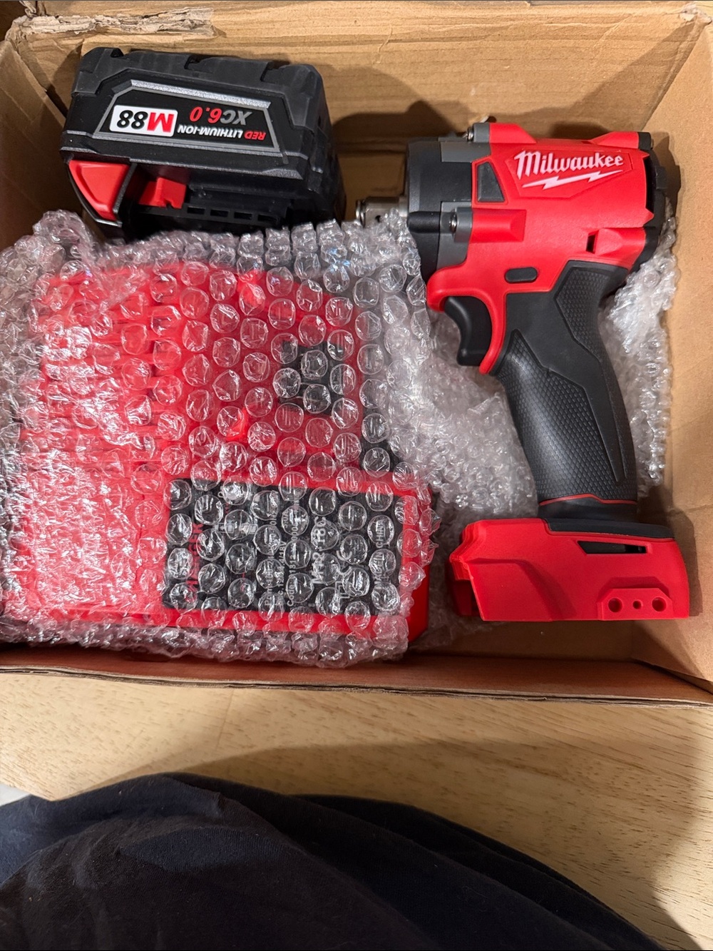Milwaukee Red Cordless Impact Wrench - Red and Black
